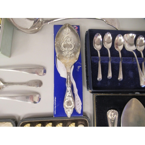 60 - A mixed lot: to include a pair of silver plated sauce ladles and a vintage set of six multi-coloured... 