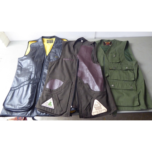 63 - A Ganton by Laurie Amistead, size 40 black shooting vest; a JCP chocolate brown fabric vest with The... 