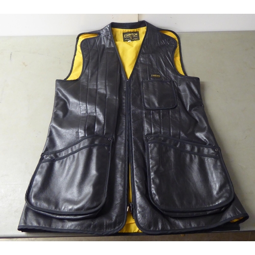 63 - A Ganton by Laurie Amistead, size 40 black shooting vest; a JCP chocolate brown fabric vest with The... 