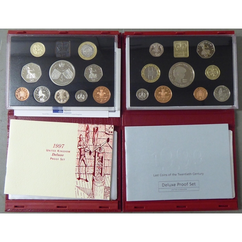 64 - Seven various Royal Mint British proof coin sets  cased