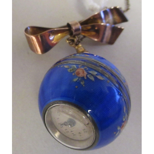 65 - A floral decorated, engine turned ball watch, on a 9ct gold ribbon tied bow brooch and safety chain&... 