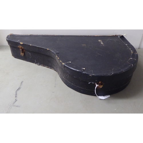 67 - A vintage four string ukulele banjo, in a carrying case 