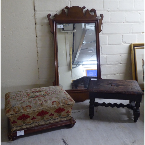 70 - An early 20thC Chippendale inspired, mahogany framed mirror with a fretworked border  25