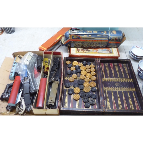 81 - Toys and games: to include vintage model electric trains; and a compendium