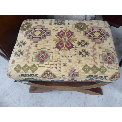 93 - A modern rustically constructed oak stool with a fabric covered cushioned seat 