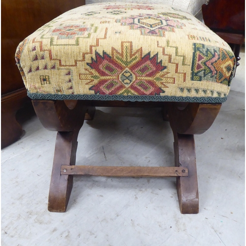 93 - A modern rustically constructed oak stool with a fabric covered cushioned seat 