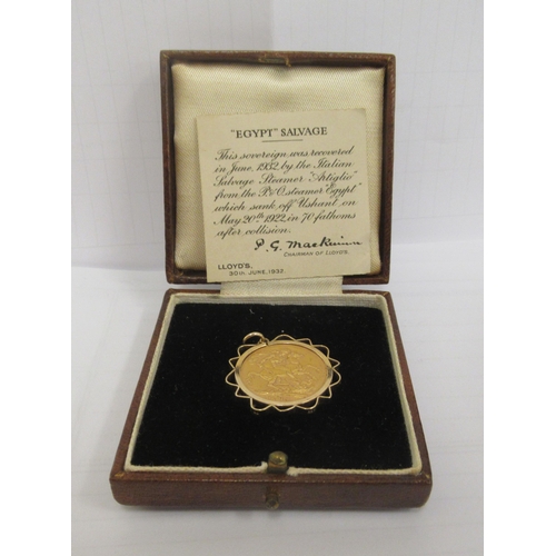 346 - A George V sovereign, St George on the obverse  1914, in a yellow metal pendant frame, together with... 