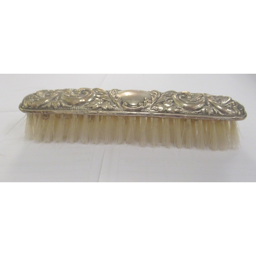 45 - Silver collectables, viz. a top hat brush, clothes brush, a hand mirror; a pair of Georgian bright-c... 