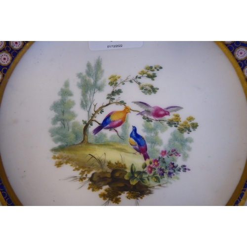 12 - Three similar 19thC Serves porcelain plates, decorated to the centres and border vignettes with stud... 