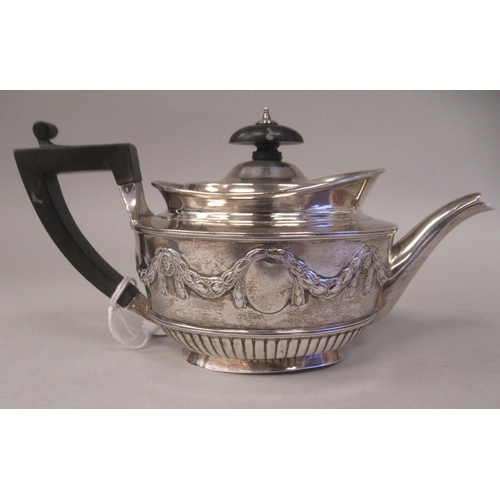 127 - A late Victorian silver batchelors oval teapot with embossed garlands, drapes and demi-reeded decora... 