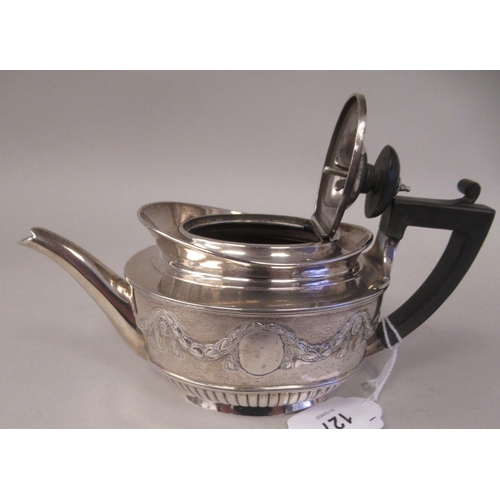 127 - A late Victorian silver batchelors oval teapot with embossed garlands, drapes and demi-reeded decora... 