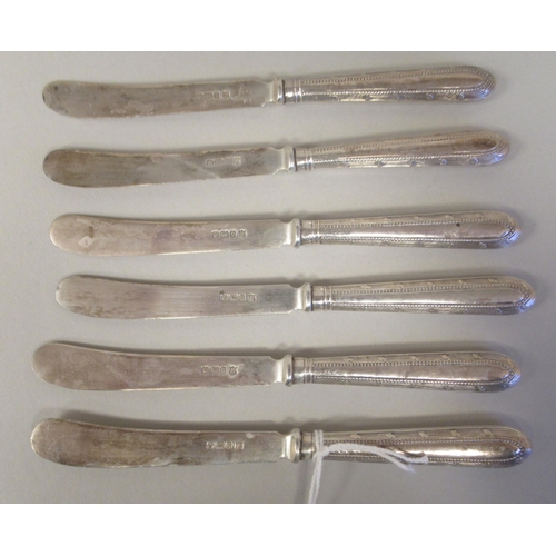 13 - A set of six tea knives, on bead bordered silver handles  Thomas Bradbury & Sons  Sheffield 1896... 