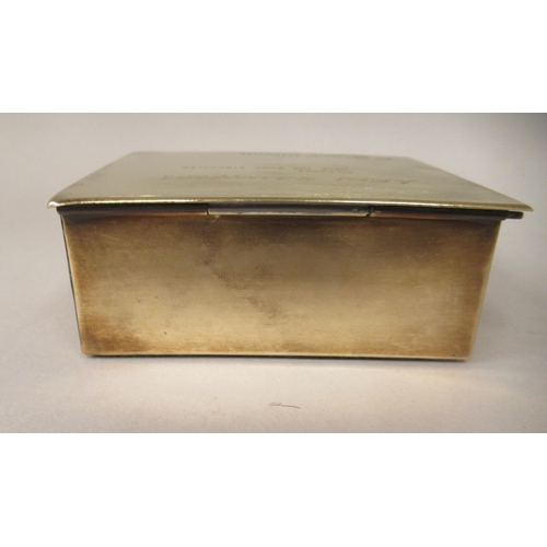 153 - A mid 20thC brass cigarette box with straight sides and a hinged lid, enclosing a cedar lined interi... 