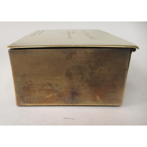 153 - A mid 20thC brass cigarette box with straight sides and a hinged lid, enclosing a cedar lined interi... 