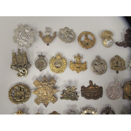 167 - Approx. fifty military cap badges and other insignia, some copies: to include The Glider Pilot Regt.... 