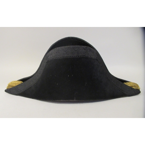 169 - A naval black cocked hat  bears the makers name CJ Chapman of Plymouth in a painted tinplate box  in... 