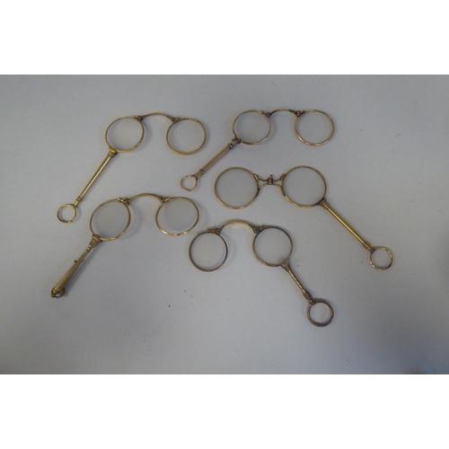 17 - Ten variously decorated early 20thC yellow metal lorgnettes 