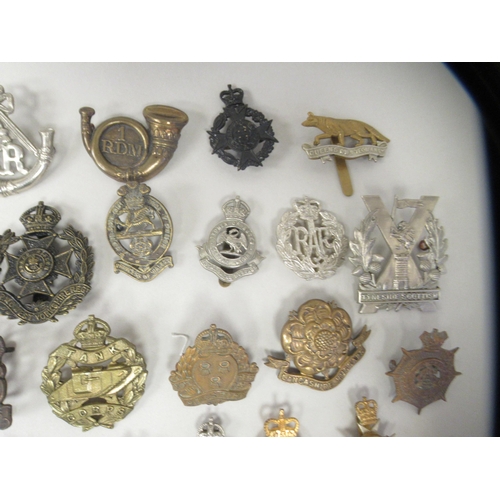 171 - Approx. fifty military cap badges and other insignia, some copies: to include The Kings Shropshire L... 