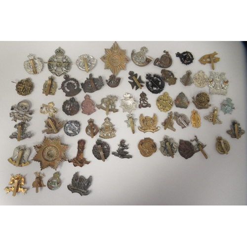 171 - Approx. fifty military cap badges and other insignia, some copies: to include The Kings Shropshire L... 