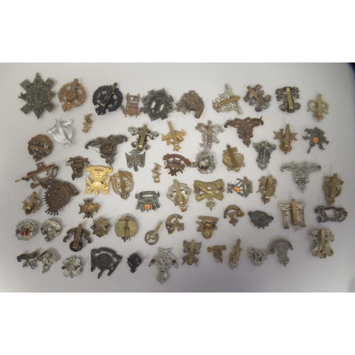 172 - Approx. fifty military cap badges and other insignia, some copies: to include The Honourable Artille... 