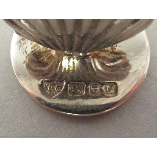 174 - A set of seven silver scallop shell design menu holders, on round stands  T-C  Birmingham ... 