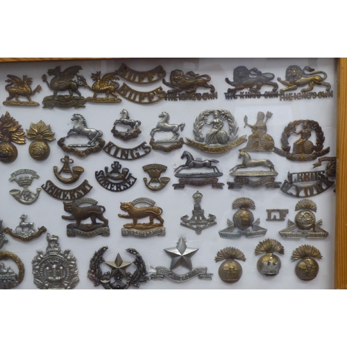 18 - Over one hundred and twenty military cap badges and other insignia, some copies: to include The Dors... 