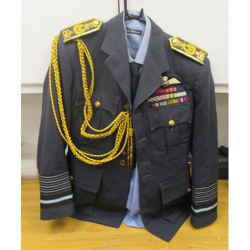 182 - An RAF Senior Officer's uniform, comprising a tunic with medal ribbons and braided epaulettes, a blu... 