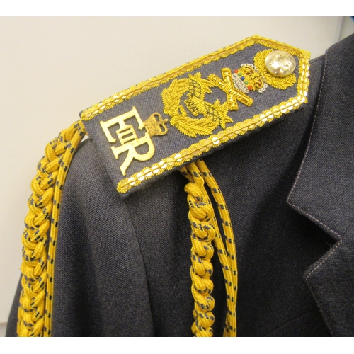 182 - An RAF Senior Officer's uniform, comprising a tunic with medal ribbons and braided epaulettes, a blu... 