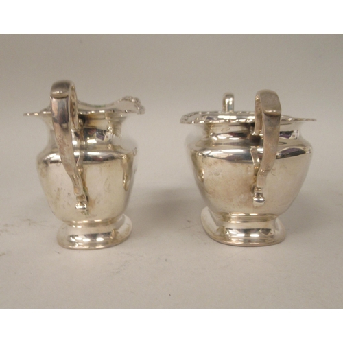 184 - A four piece silver tea set of ogee form with applied wire, wavy rims  comprising a teapot with... 