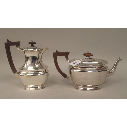 184 - A four piece silver tea set of ogee form with applied wire, wavy rims  comprising a teapot with... 