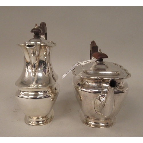 184 - A four piece silver tea set of ogee form with applied wire, wavy rims  comprising a teapot with... 