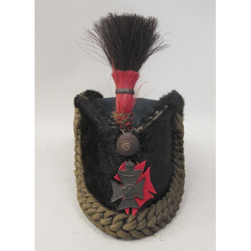 186 - A Kings Own Rifle Corps uniform headdress; a vintage Auxiliary Fire Service black helmet; a green pa... 