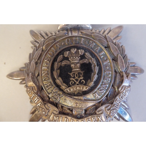 19 - A Middlesex Regiment 3rd Volunteers Battalion helmet plate (Please Note: this lot is subject to the ... 