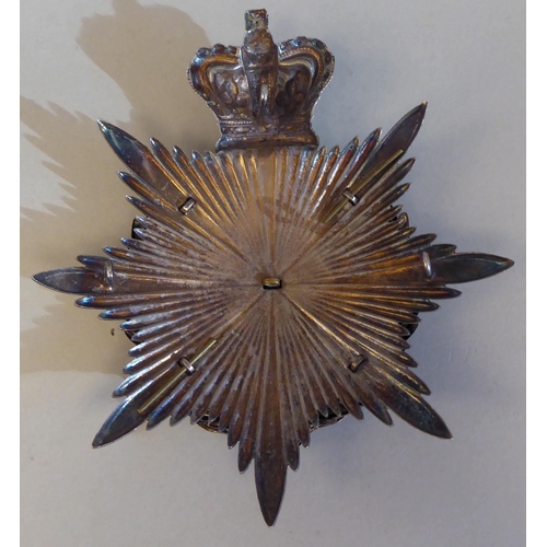 19 - A Middlesex Regiment 3rd Volunteers Battalion helmet plate (Please Note: this lot is subject to the ... 