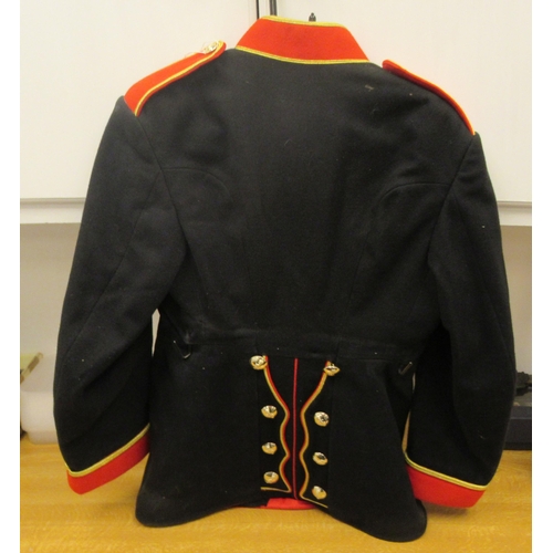 192 - A British REME Band ceremonial black tunic with a red collar, cuffs and epaulettes (Please Note: thi... 