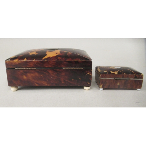 193 - A late 19thC tortoiseshell clad trinket box, the domed hinged lid on a button clasp, enclosing a com... 