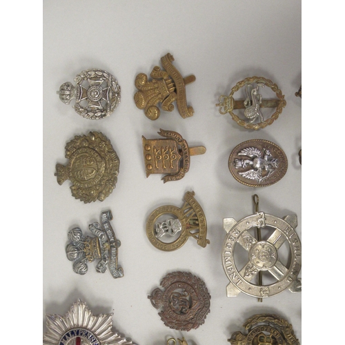 197 - Approx. fifty military cap badges and other insignia, some copies: to include Mine Clearance Service... 