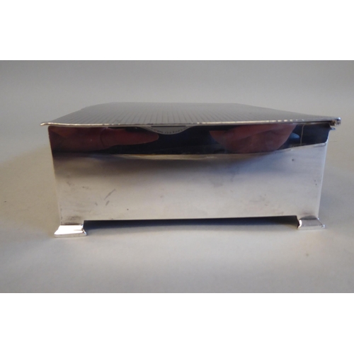 2 - A silver and cedar lined cigarette box with straight sides and engine turned decoration to the hinge... 