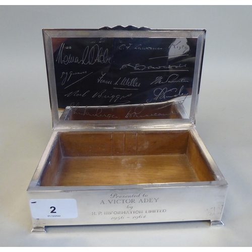 2 - A silver and cedar lined cigarette box with straight sides and engine turned decoration to the hinge... 