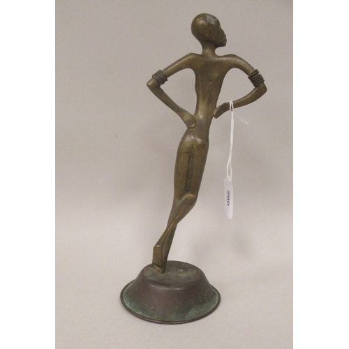 200 - An African bronze standing female dancing figure with hands on hips and a domed, circular base  11