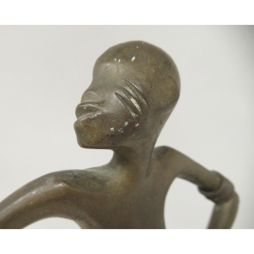 200 - An African bronze standing female dancing figure with hands on hips and a domed, circular base  11