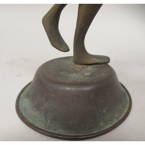 200 - An African bronze standing female dancing figure with hands on hips and a domed, circular base  11