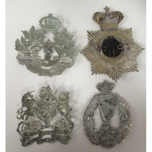 204 - Four Victorian regimental helmet plates, viz. The Cameroonians Scottish Rifles; The Hampshire 1st Vo... 