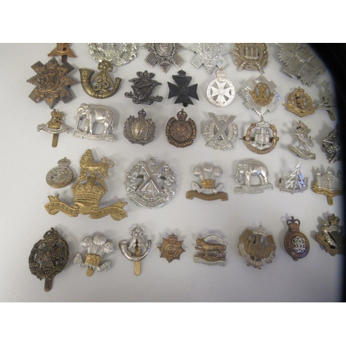 207 - Approx. fifty military cap badges and other insignia, some copies: to include 4th Queen's Own Hussar... 