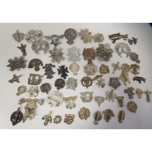 207 - Approx. fifty military cap badges and other insignia, some copies: to include 4th Queen's Own Hussar... 