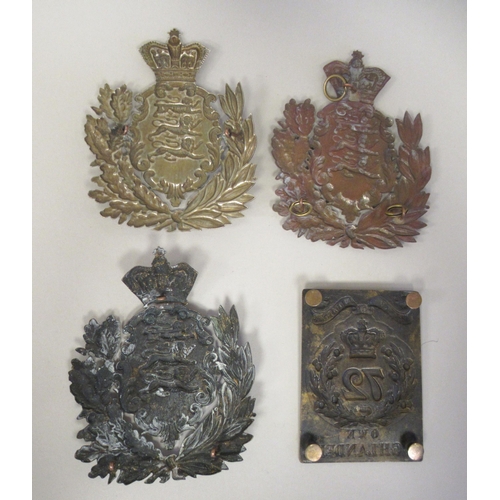 209 - A 72nd Duke of Albany's Own Highlander's brass shoulder belt device; and three similar Hampshire Reg... 