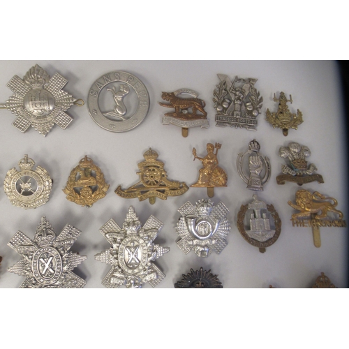 211 - Approx. fifty military cap badges and other insignia, some copies: to include 19th Alexandra PWO Hus... 