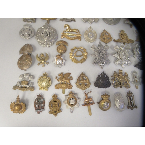 211 - Approx. fifty military cap badges and other insignia, some copies: to include 19th Alexandra PWO Hus... 