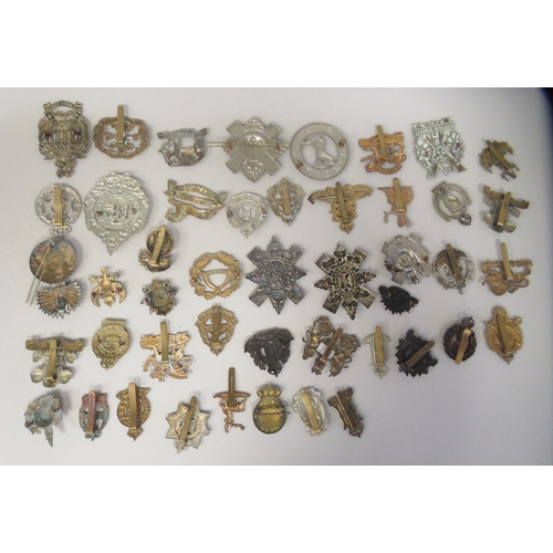 211 - Approx. fifty military cap badges and other insignia, some copies: to include 19th Alexandra PWO Hus... 