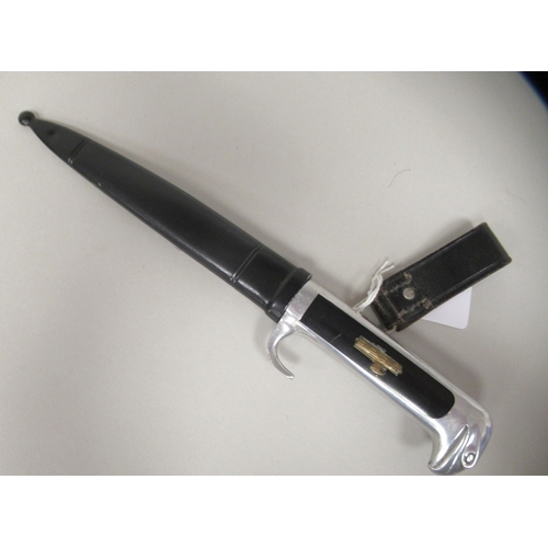 213 - An Italian Fascist era, political officer's dress dagger with an aluminium black celluloid handle an... 